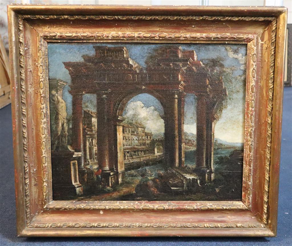 18th century Italian School Architectural caprice with figures beside a ruined arch, houses beyond 14.5 x 17.5in.